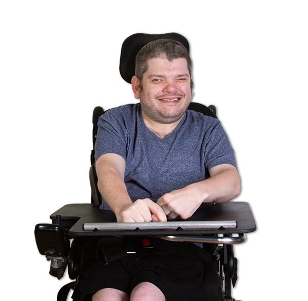 A young man in a wheel chair smiling
